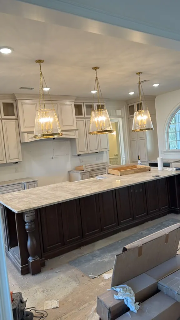 White kitchen with a marble-look stone island